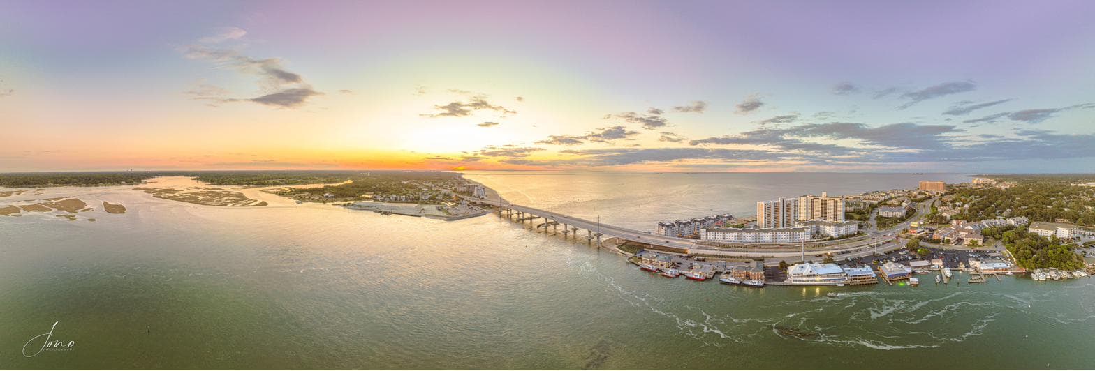 Aerial panorama of the Lesner Bridge over Shore Drive at sunset